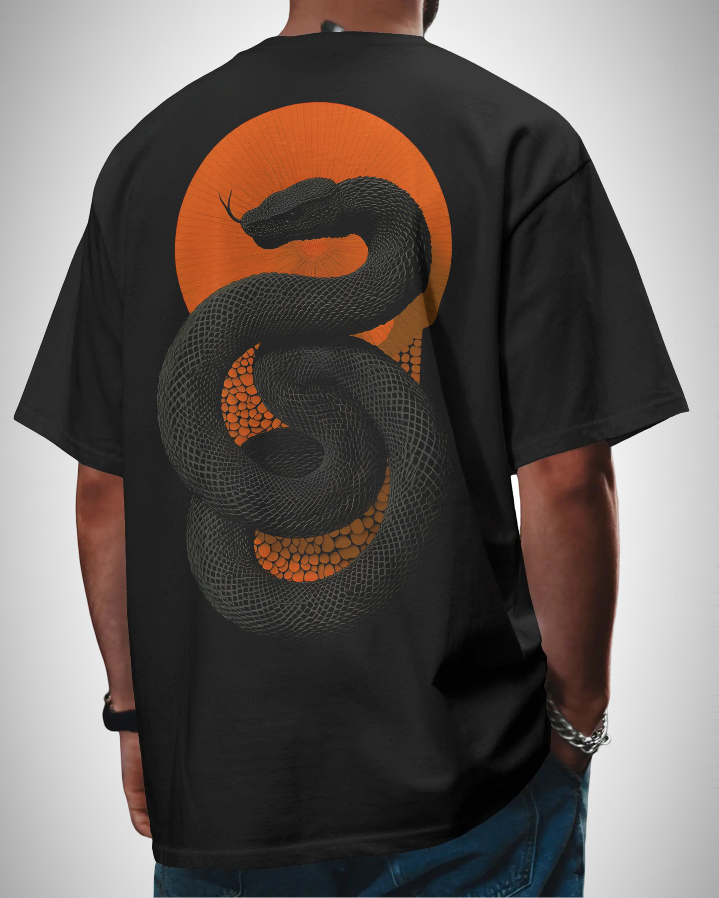 Venomous Sunset, back view, man wearing, black color, oversized t-shirt, graphic printed t-shirt.