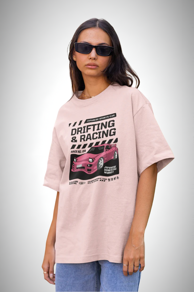 Drift Edition RX7, pink color, front side, girl with glasses wearing, oversized graphic printed t-shirt.