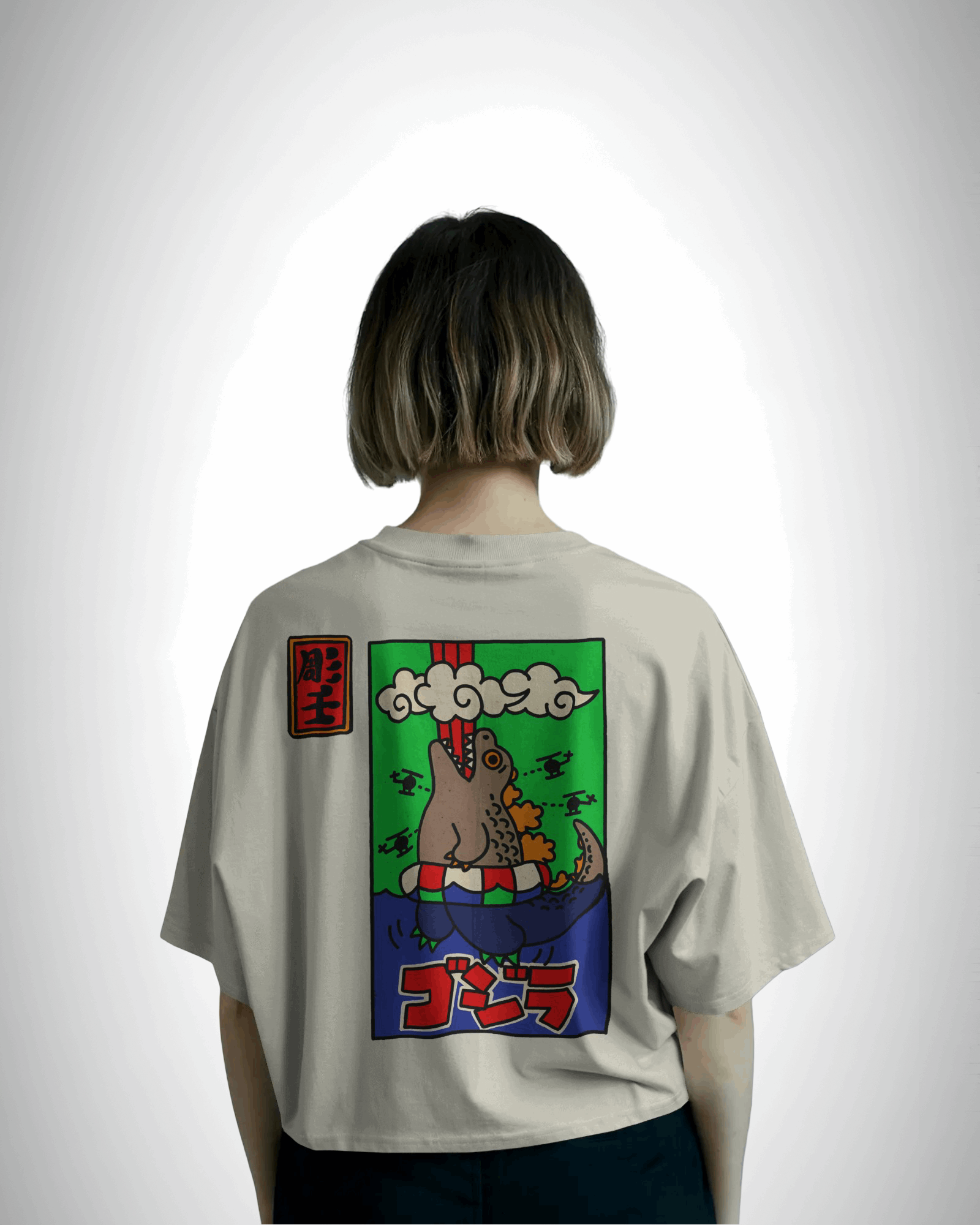 Godzilla Horrinen, back view, girl wearing, offwhite color, oversized t-shirt, graphic printed t-shirt.