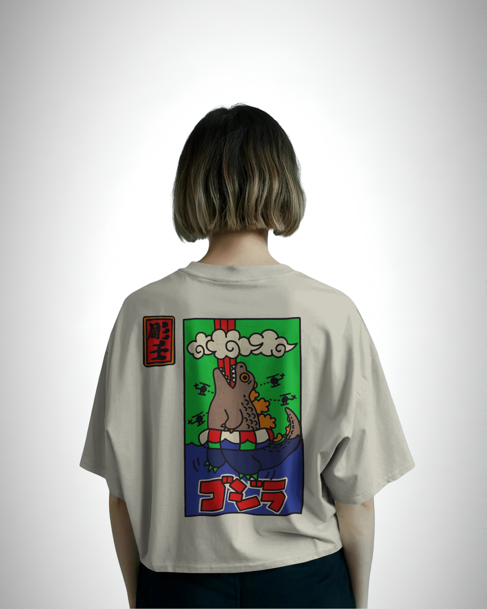 Godzilla Horrinen, back view, girl wearing, offwhite color, oversized t-shirt, graphic printed t-shirt.