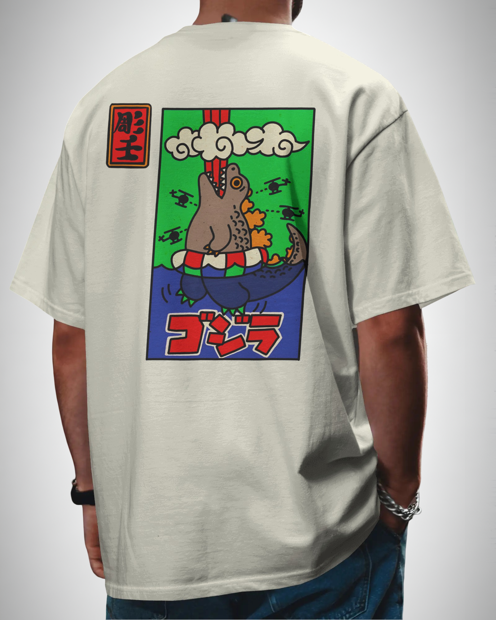 Godzilla Horrinen, back view, man wearing, offwhite color, oversized t-shirt, graphic printed t-shirt.