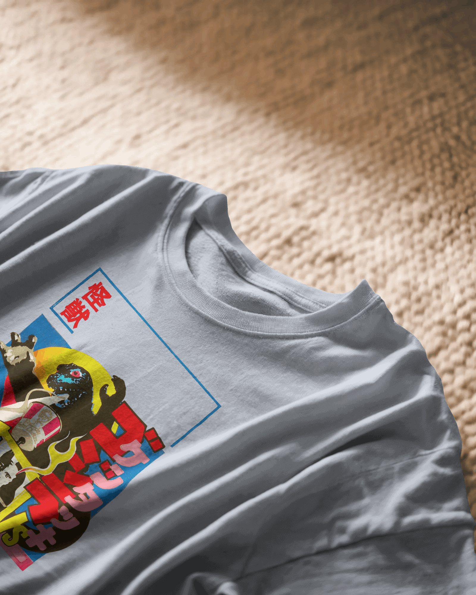 kaiju kravings, grey color, front side, on carpet, closeup, oversized graphic printed t-shirt.